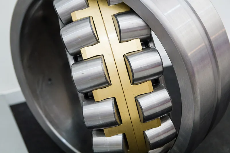 Close-up of a roller bearing with brass cage